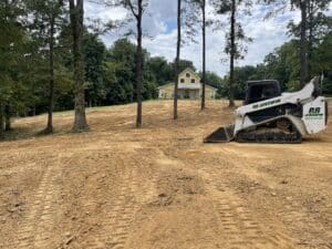 Bulldozer clearing brush