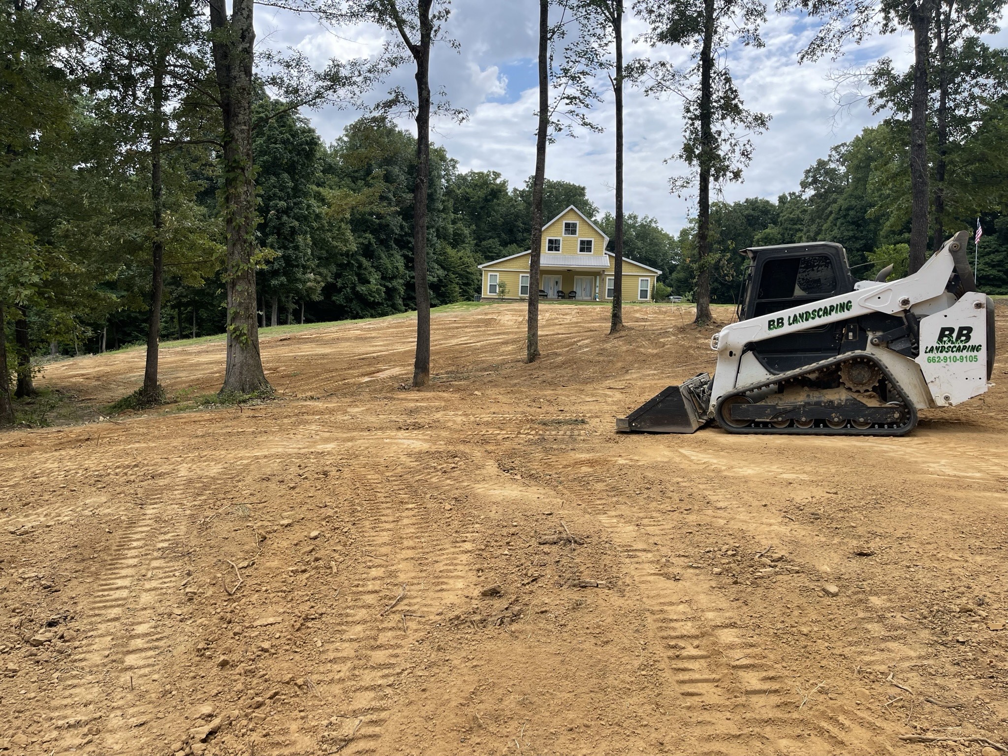 Bulldozer clearing brush